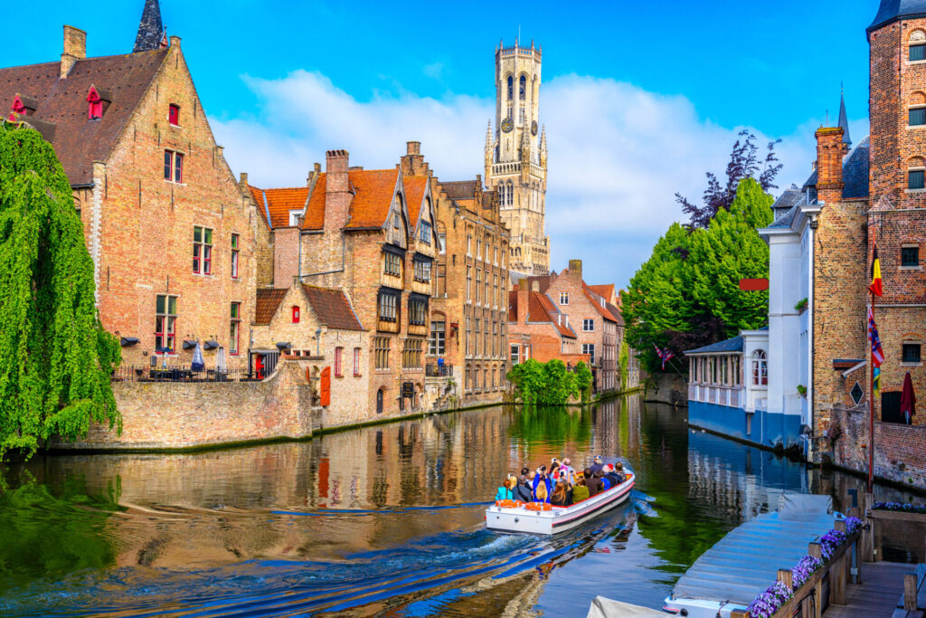 Sailing the canal and looking towards the Belfry of Bruges
