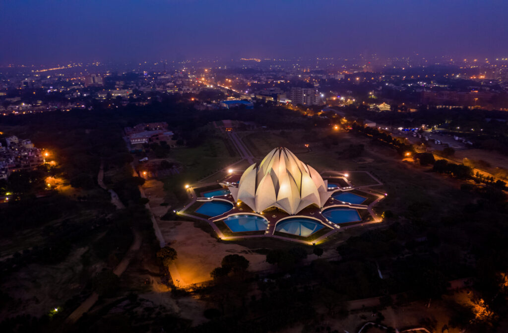 Delhi lotus building at night, India, aerial drone view
