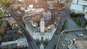 Aerial footage of British Town Center and City Centre of Luton England at Sunset golden hour time. Luton Town Hall.