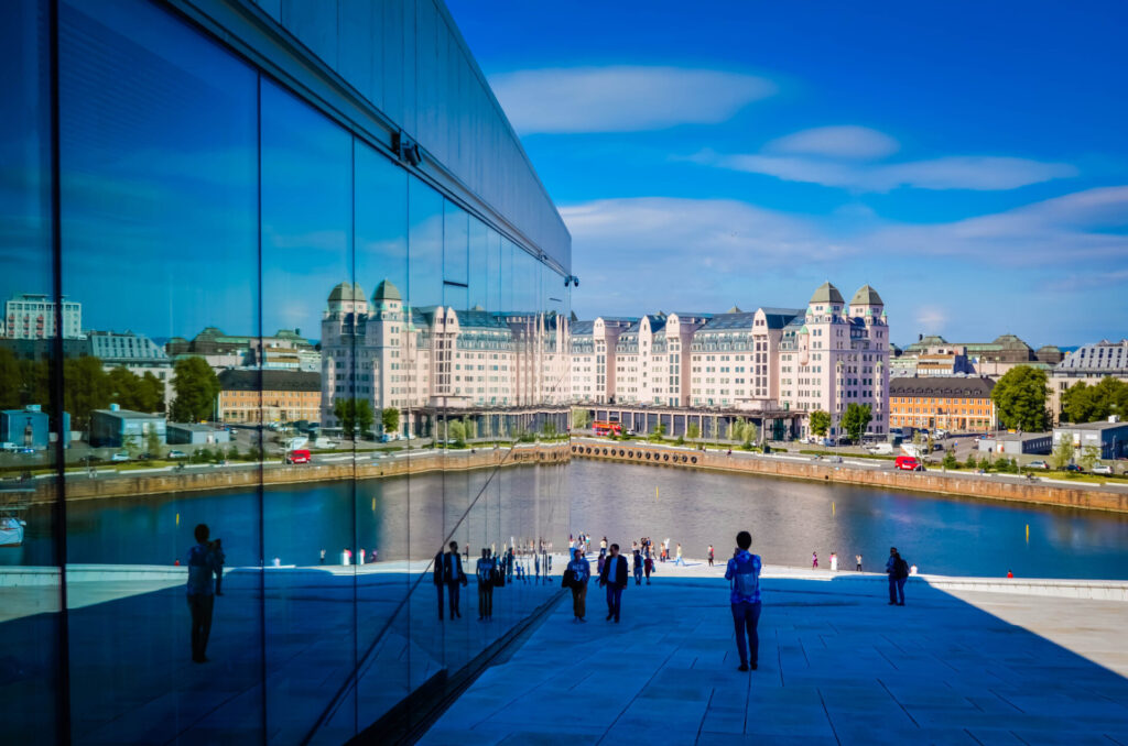 Havnelageret, or “Harbour House”, reflects onto Oslo Opera House