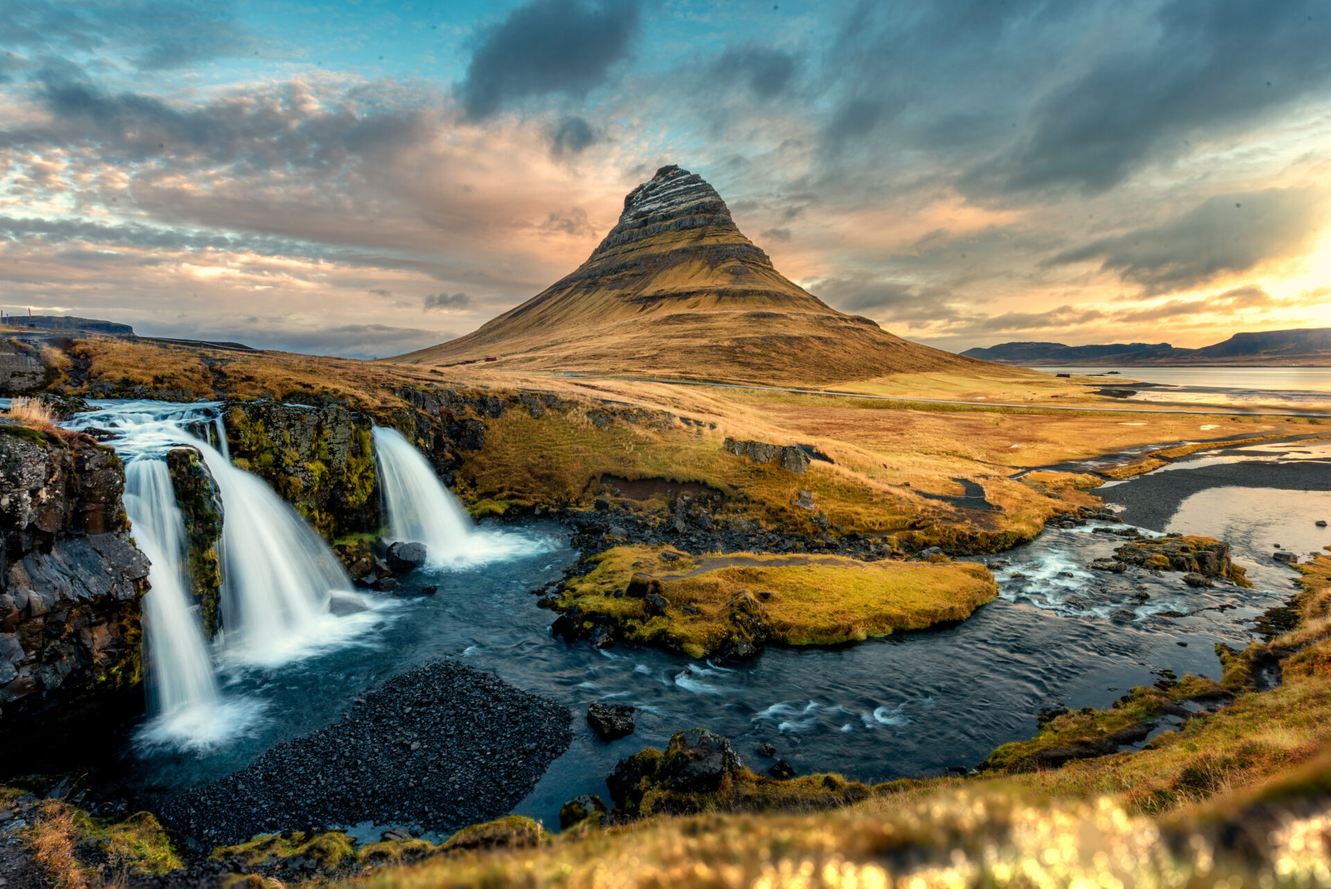 Colorful sunrise landscape view on Kirkjufellsfoss waterfall. Amazing morning scene near Kirkjufell volkano, Iceland, Europe.